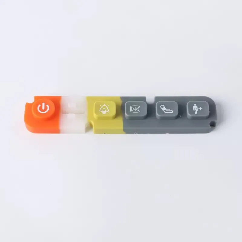 Multi-color molded silicone button strip for a control interface